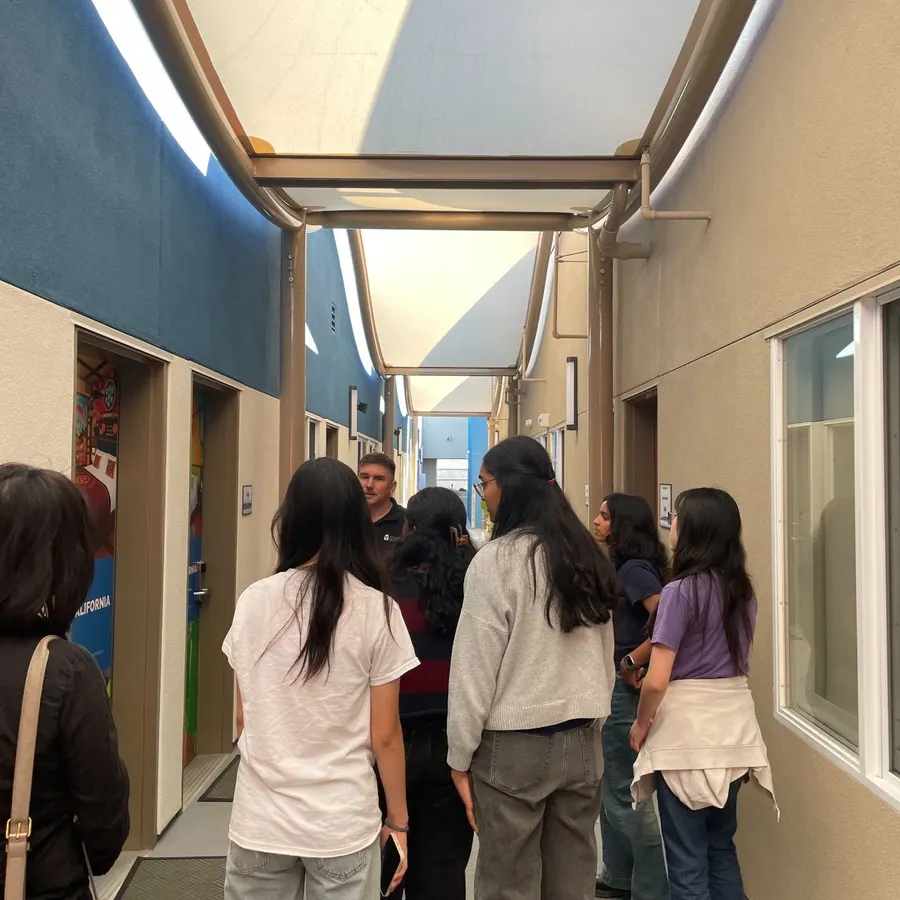 The team walking down the corridor at Ronald McDonald House Charities