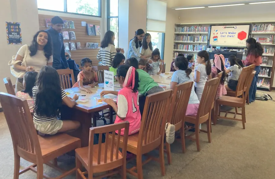 Families and students at the tables during the workshop