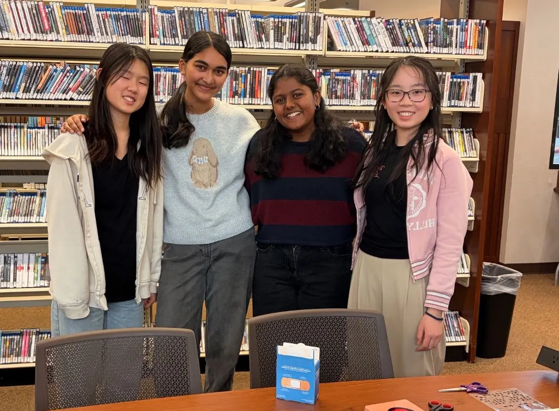 Four ProjectPatho members in the 4s Library after the first aid workshop
