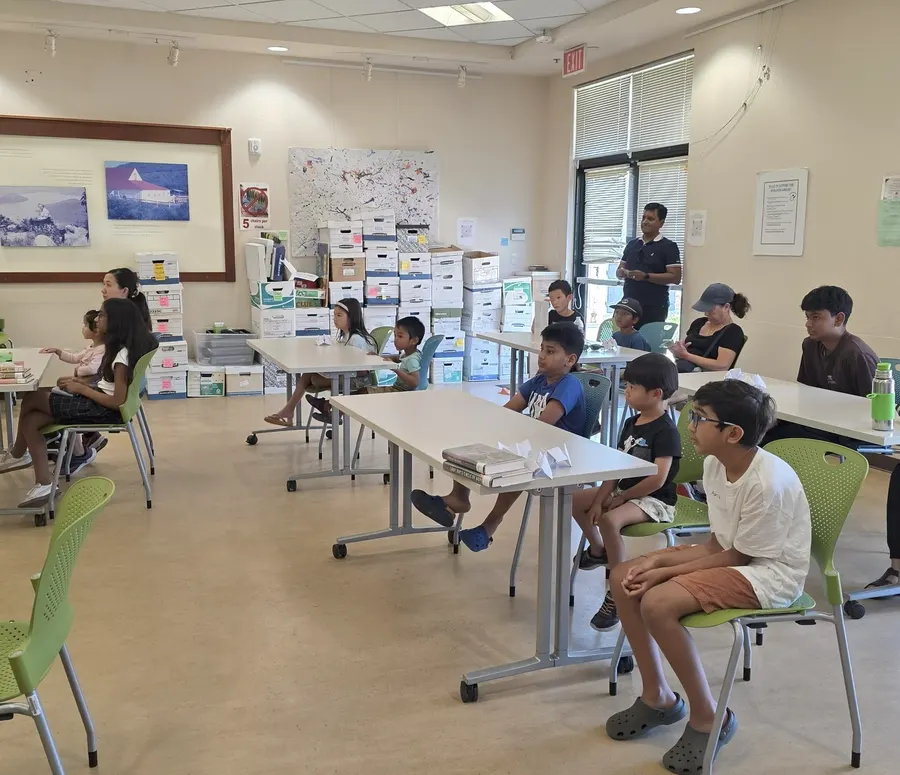 Children seated at the tables during the immune system workshop