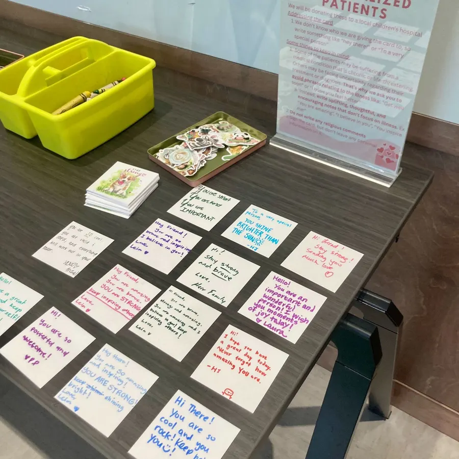 Cards written for hospitalized patients laid out on the table